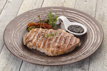 Grilled pork steak with pepper sauce