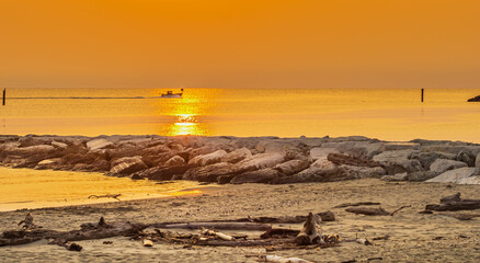 Early sunrise seen from a wild beach somewhere on the Adriatic Sea in central Italy. © Piotr