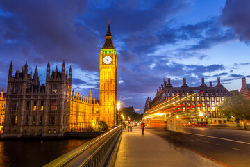 Fototapeta na wymiar The Parliament, the Big Ben and the Westminster bridge at night, London, England