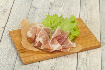 Italian prosciutto pork meat over board