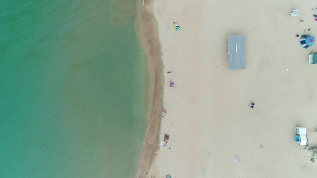 Aerial view: sea coast and large sandy beach. Aerial shot of the beach and sea