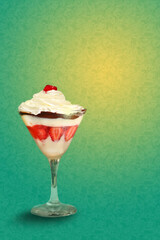 A cup with a strawberry dessert with cherry, whipped cream and chocolate (sobremesa de morango na taça)