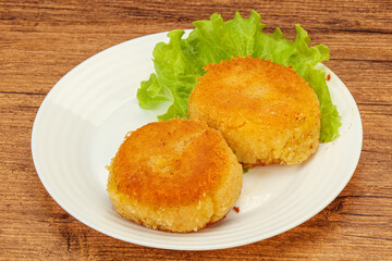 Vegan cuisine - Potato cutlet in the plate