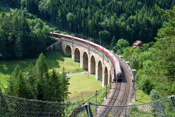 Train on the viaduct over the Adlitzgraben on the Semmering Railway. The Semmering Railway is the...