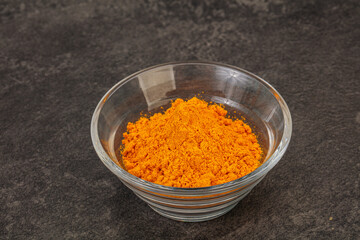 Tumeric powder in the bowl