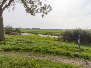 A ditch flowing between the meadows