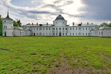 Fototapeta premium Kachanivka, Ukraine - June 2020: Beautiful ancient Tarnovsky palace and park in Kachanivka. Ukrainian heritage, tourist attractions. Landscape and park design