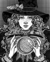 witch in the hat casts a spell with a magic crystal ball - 385099395