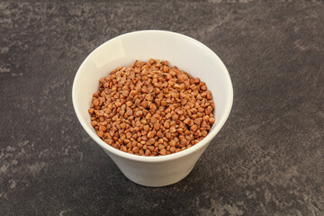 Raw buсkwheat cereal in the bowl