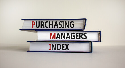 Books with words 'PMI' - 'Purchasing Managers Index' on beautiful white background, copy space. Business concept.