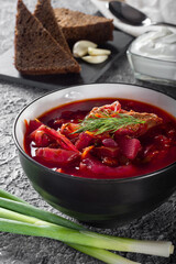 Borsch. Ukrainian soup. The red soup. Borscht with sour cream and onions, rye garlic bread. Traditional Russian borscht with sour cream.