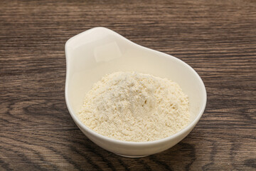 Wheat flour heap in the bowl