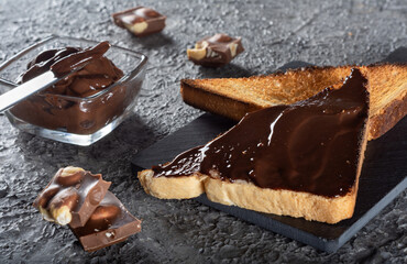 Toast with coffee and chocolate cream cheese. Breakfast with toast. Chocolate-covered toast.