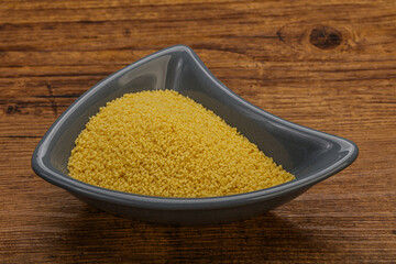 Raw cous cous heap in the bowl