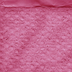 Red vintage and old looking crumpled paper background. Retro cardboard texture. Grunge paper for drawing. Ancient book page. Present wrapping.