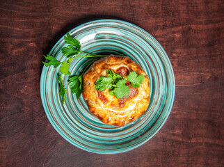 Shepherd or cottage pie with fresh green parsley. Top view.