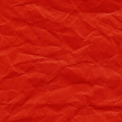 Red vintage and old looking crumpled paper background. Retro cardboard texture. Grunge paper for drawing. Ancient book page. Present wrapping.