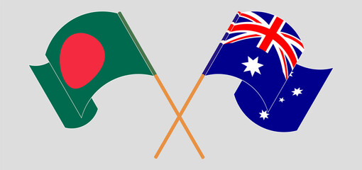 Crossed and waving flags of Bangladesh and Australia