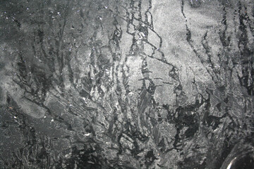 Fototapeta na wymiar Fosty silver ice patterns on glass