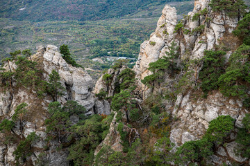 Fototapeta premium panoramic view of yellow autumn mountains against a background of blue haze and storm clouds