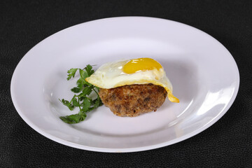 Beef cutlet with egg and coriander