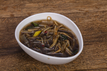 Thai style soup with meat and mushrooms