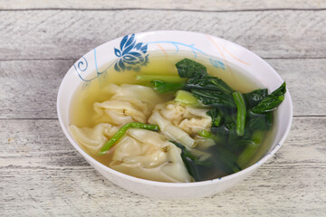 Asian traditional Wonton soup with herbs