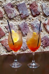 glass of aperol spritz on a wooden table