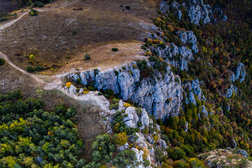 yellow autumn mountains against a background of blue haze and storm clouds