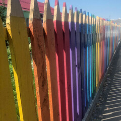 Playground fence made of staves carved and painted as pencils