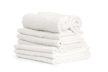 several white beach cotton towels folded on white background