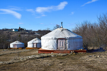 Fototapeta na wymiar Three Mongolian yurts in spring in a nature Park