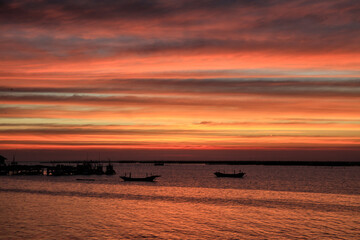 Dramatic Orange and cloudy sky over Fisherman's harbor