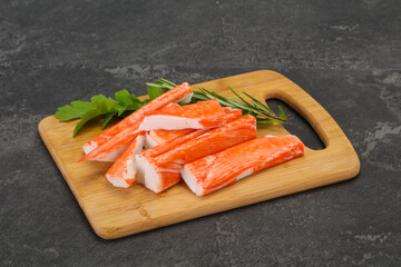 Crab stick surimi over board