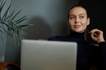 portrait of a young woman of European appearance student manager reading an interesting book in a...