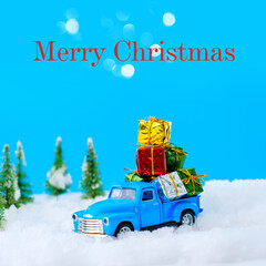 Vintage blue truck carrying many gifts with copy space