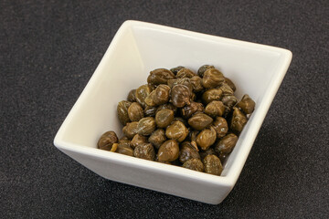 Tasty capers in the bowl