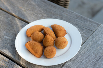 Salgados, salgadinhos, brazilian snacks and party finger food, rissoles, coxinhas, bolinhas de queijo.
