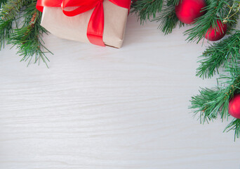 christmas card with christmas tree and ballson white wooden background. Top view, copy space for text. Greeting, design template, winter holidays background or frame