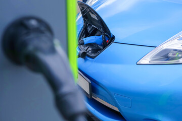 Naklejka premium Recharging of electric cars.