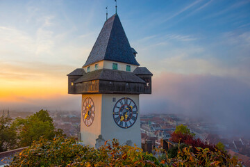 The famous clock tower on Schlossberg hill, in Graz, Styria region, Austria, at sunrise. Beautiful...
