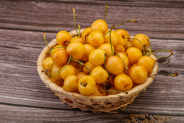 Naklejka na ściany i meble Sweet ripe yellow cherry heap