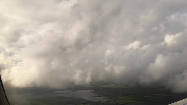 Airplane window view during landing to Amsterdam 
