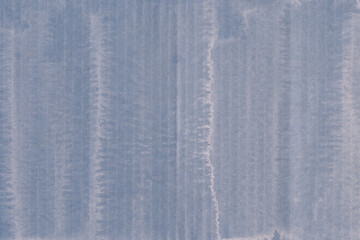 A blue vintage rough sheet of carton. Recycled environmentally friendly cardboard paper texture. Simple minimalist papercraft background.