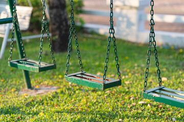 empty chain swing in children playground