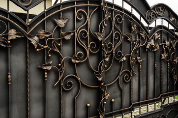 Metal gate with abstract forged leaves
