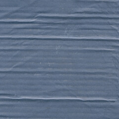 A blue vintage rough sheet of carton. Recycled environmentally friendly cardboard paper texture. Simple minimalist papercraft background.
