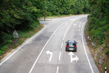 Aerial view of road in a beautiful green forest