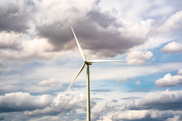 Wind turbine generator on blue sky
