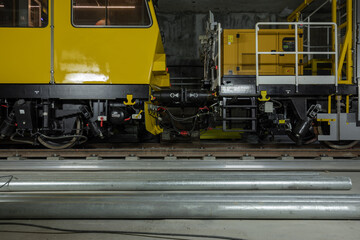 Railway line maintenance vehicle standing on rails ready to work. 